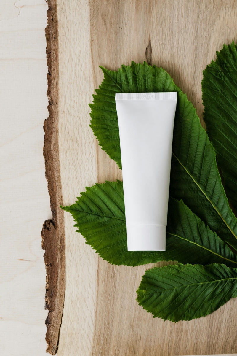 blank-cream-tube-on-leaf