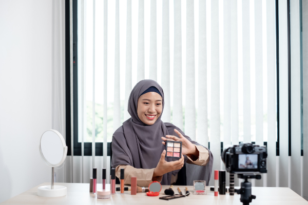 Muslim women making video beauty vlogger bloggers doing a cosmet